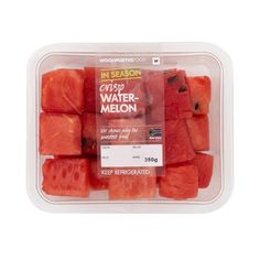 watermelon cubes in a plastic container on a white background with the label