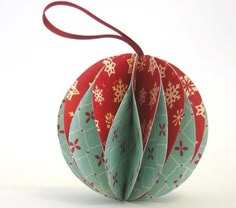 an ornament shaped like a hot air balloon with snowflakes on it