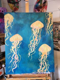 a painting of three jellyfish in the ocean