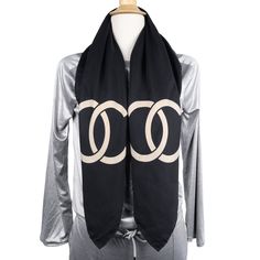 Authentic Chanel silk scarf in beige and black. Rare, a must-have. Very beautiful! This effortlessly elegant silk scarf wrap literally envelops you in a blanket of delicate softness. The iconic pattern has been revitalized with hints of pop colors to liven things up. Detailed features 100% silk CC pattern. Enjoy this beautiful scarf all seasons. You will love it! This scarf would make a great gift and is a perfect neck scarf to wear under a jacket or blouse. Elegant Black Silk Scarf For Formal Occasions, Chic Formal Silk Shawl Scarf, Black Silk Shawl For Formal Occasions, Luxury Black Silk Scarf For Formal Occasions, Formal Black Shawl Scarves, Luxury Beige Scarf For Formal Occasions, Chic Black Scarves For Evening, Chic Black Scarf For Evening, Luxury Black Scarf For Formal Occasions