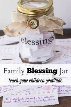 a jar filled with paper and some writing on it that says, family blessing jar teach your children gratitude