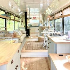 the inside of a bus with wood floors and windows