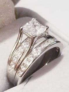 an engagement ring and wedding band set with princess cut diamonds in white gold or silver