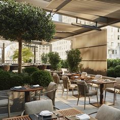 an outdoor dining area with tables and chairs