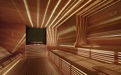 the inside of a wooden sauna with lights shining down on it's walls