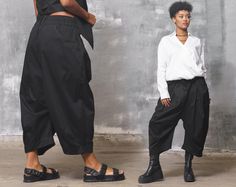 Inspire them all in the black baggy pants women. This avant garde clothing - black baggy pants women feature a mid waisted construction, with front botton and zipper closure, two pockets hips and two non-standard back pockets. Perfect for work and daily life. This avant garde clothing is designed to flatter every body type and fit numerous occasions. These cotton pants feature an avant garde cut, wide crotch and an elastic at the back of the waist. High rise with a black baggy pants women, you'l Black Baggy Pants, Low Crotch Pants, Baggy Pants Women, Mid Waist Pants, Fashion Capsule Wardrobe, Drop Crotch Pants, Denim Pants Women, Clothing Black, Fashion Capsule