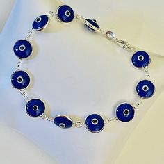 Pulsera, Plata 925 Ojo Del Mal Color Azul/Bracelet, Silver 925 Evil Eye Color Blue Blue Sterling Silver Bracelets, Blue Sterling Silver Round Bracelets, Blue Bracelet 925 Silver As A Gift, Handmade Sterling Silver Blue Evil Eye Bracelet, Handmade Blue Evil Eye Bracelet In Sterling Silver, Handmade Blue Sterling Silver Evil Eye Bracelet, Adjustable Blue Sterling Silver Nickel-free Bracelet, Blue Sterling Silver Bracelet Gift, Blue Sterling Silver Bracelet As Gift