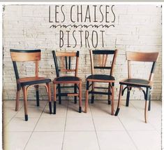 four wooden chairs against a brick wall with the words les chasses bistrot