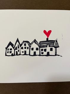 a drawing of houses with a red heart on top