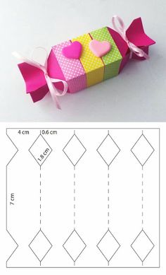 an origami box with hearts on it and the instructions for how to make it