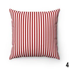 a red and white striped pillow on a white background