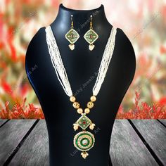 This is a stunning handmade necklace perfect for high end Jewelry Collector, a keeper in Traditional Vintage Indian/Pakistani Bridal jewelry and a Luxury Gift for your Daughter, Sister or Wife on Wedding or Anniversary. Perfect for any type of occasions, weddings And celebrations and a beautiful & memorable gift for weddings and special occasions. -Item Code:- L2019 -White Beaded Rajwada Necklace Set with Earrings. -Gold Plated Set with Kundan Stones which shine like polki. -Metal: Gold plated brass -Earrings are 60mm long and 30mm wide -Necklace length with pendant 12" approx  -Meenakari on kundan Set. -Quantity:- One Necklace Set Please see more different designs here:- https://www.etsy.com/in-en/shop/LUCKYJEWELSART?ref=seller-platform-mcnav I make every item of my collection with a lot Handmade Green Bridal Necklace For Wedding, Handmade Bohemian Green Bridal Necklace, Handmade Green Bohemian Bridal Necklace, Bohemian Handmade Green Bridal Necklace, Wedding Beaded Chain Necklace, Festive Pendant Jewelry With Beaded Chain, Green Temple Jewelry Necklace With Faceted Beads, Green Beaded Bridal Necklace Gift, Green Beaded Bridal Necklace