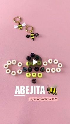 an image of some beads and other items on a pink surface with the words abjeta above it