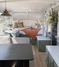 the inside of a camper with lots of furniture