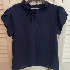 Navy Blue Short-Sleeved Blouse With Button-Front Closure; Sz 13-14 - Never Worn Navy Short Sleeve Blouse For Summer, Blue Ruffled T-shirt For Summer, Navy Short Sleeve Top For Spring, Casual Navy Short Sleeve Blouse, Blue Short Sleeve Top For Spring, Navy Short Sleeve Tops For Work, Blue Casual Short Sleeve Top For Spring, Casual Blue Short Sleeve Top For Spring, Blue Short Sleeve Shirt With Ruffles