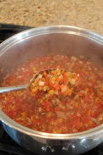 a pot filled with soup on top of a stove