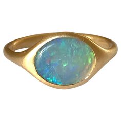 Dalben design 18k yellow gold satin finishing ring with a 1 carat bezel-set oval shape Australian crystal opal . Ring size US 6 - EU 51 re-sizable to most finger sizes. Bezel setting dimension: width 11 mm, height 9,2 mm. The ring has been designed and handcrafted in our atelier in Italy Como with a rigorous quality workmanship . Italy Como, Crystal Opal, Gold Satin, Opal Ring, Yellow Gold Ring, Opal Crystal, 1 Carat, Yellow Gold Rings, Bezel Setting