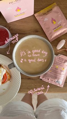 there is a bowl of soup on the table with its contents labeled in pink and white