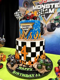 a monster truck themed birthday cake on a table