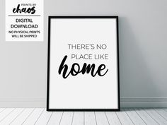 there's no place like home printable poster in black frame on white wall