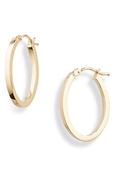 Subtle sculpting adds an architectural twist to the sleek silhouette of these everyday hoops crafted from polished 14-karat gold. 3/4" drop, 3/8 diameter 1/8" width 14k gold Made in Italy Modern 14k Gold Oval Hoop Earrings, Modern Oval 14k Gold Hoop Earrings, Timeless 14k Gold Oval Hoop Earrings, 14k Gold Oval Hoop Earrings Timeless Style, Oval 14k Gold Hoop Earrings Timeless Style, Timeless Oval 14k Gold Hoop Earrings, Timeless 14k Gold Polished Hoop Earrings, Formal 14k Gold Hoop Earrings With Polished Finish, 14k Yellow Gold Polished Hoop Earrings