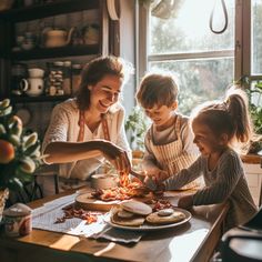 a woman and two children are preparing food on a table in front of a window