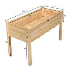 a wooden planter sitting on top of a table with measurements for the bottom section