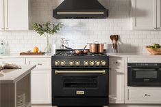 a black stove top oven sitting inside of a kitchen next to a white countertop