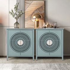 two blue sideboards sitting next to each other on top of a rug