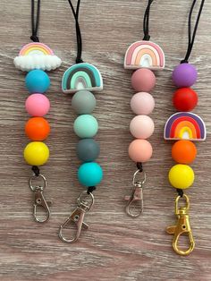 "Silicone bead lanyard for teachers, nurses, or any profession needing an ID badge holder. These lanyards are comfy, lightweight, and the perfect gift for your favorite people or for yourself! Choose from these different color combos:   ☆ Mint & Gray   ☆ Bright Rainbow   ☆ Blush Pink   ☆ Rainbow with Cloud Each lanyard is made with durable, lightweight silicone beads on nylon string with a breakaway clasp. Easily add your own ID badge holder to the lobster claw clasp. These handmade lanyards are Handmade Lanyards, Rainbow Blush, Silicone Bead Lanyard, Teacher Lanyards, Bead Lanyard, Personalized Lanyards, Lanyard Teacher, Teacher Lanyard, Beaded Lanyards