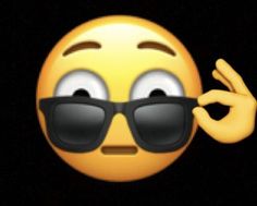 a yellow emoticon wearing sunglasses and making the peace sign with his hand,