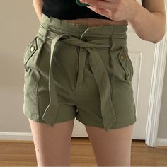 Green Shorts, Tie Waist, High Waisted, Zip Front Button In The Top Khaki Material, Ruched Waist, Flattering Fit Size Large, But Fits Both Medium And Large Brand New Without Tags Never Worn Fancy Or Short Office Short Summer Green Khaki Chic Belted Cotton Shorts, Trendy Green Bottoms With Tie Waist, Trendy High-waisted Shorts With Tie Waist, Chic High-waisted Khaki Shorts, Chic Khaki Shorts For Spring, Trendy Belted Cotton Shorts, High Waist Cotton Shorts With Tie Waist, Chic Khaki Paperbag Waist Bottoms, Chic High Waist Tie Waist Shorts