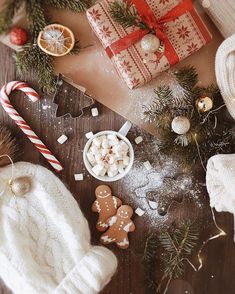 a table topped with christmas decorations and gifts