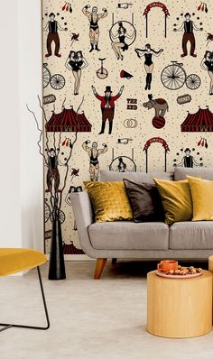 a living room filled with furniture and wallpaper covered in circus themed design on the walls