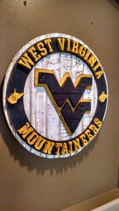 the west virginia mountaineers sign is on the wall