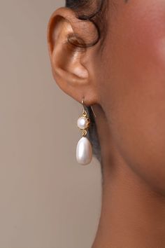 The design of Mira features a freshwater drop pearl suspended from a pearl encased in a 14k gold-filled bezel cup.The gold hook on these earrings is extra fine and comfortable to wear.  A timeless and versatile accessory, these earrings are suitable for any occasion, from formal events to casual outings. Packaged in an elegant plastic-free reusable jewelry box, they make the perfect gift or special treat for oneself.  14k gold-filled components Freshwater pearls Hypoallergenic, suitable for even the most sensitive skin Delivered in a 100% silk jewelry pochette inside a gift box Sustainable magnetic closure jewelry box and customizable card   Please note, as we use only natural pearls, shape and size may vary slightly.  We offer a one year guarantee from the date of delivery. Lost an earrin Classic Long Drop Pearl Earrings With Ear Wire, Classic Gold Long Drop Pearl Earrings, Elegant 14k Gold Filled Pearl Drop Earrings, Elegant 14k Gold-filled Teardrop Earrings, 14k Gold Filled Elegant Teardrop Earrings, 14k Gold Long Drop Pearl Earrings, Elegant 14k Gold Teardrop Pearl Earrings, Anniversary 14k Gold Filled Pearl Drop Earrings, 14k Gold Filled Teardrop Pearl Earrings For Anniversary