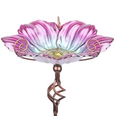 a glass flower on a metal stand with a pink and blue flower in the center