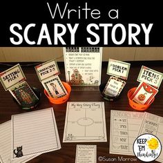 a table with some writing materials on it and an orange bucket full of books next to it