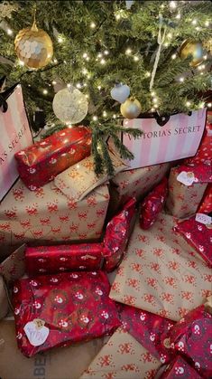 many wrapped presents under a christmas tree