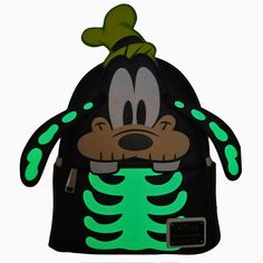 Add Goofy the spooky skeleton to all of your spooky adventures. Featuring Goofy as a skeleton, this glow-in-the-dark touch will give you an edge on your scary fun holiday festivities. Dimensions: 11.5"H X 9.5"W X 4.5"D Material: Faux leather (polyurethane) Features: Backpack features adjustable straps, sturdy metal hardware, a front zip pocket, 2 side pockets, and an inside slip pocket in the main compartment. Additional features include applique, debossed, Glow-in-the-dark, and printed details. Black Disney Backpack For Halloween, Themed Black Backpack For Theme Parks, Black Halloween Novelty Backpack, Black Novelty Backpack For Halloween, Disney Halloween Backpack For Disney Trips, Halloween Themed Travel Backpack, Themed Halloween Travel Backpack, Black Backpack For Halloween Cosplay, Themed Backpack For Everyday Use And Halloween