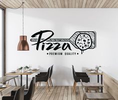 a restaurant wall decal with the word pizza on it