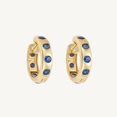 Gold & Blue Sapphire Huggie Earrings Blue Huggie Hoop Earrings In Fine Jewelry, Elegant Blue 14k Gold Huggie Earrings, Blue Huggie Hoop Earrings, Blue Sapphire Hoop Earrings, Elegant Sapphire Huggie Earrings, Luxury Sapphire Hoop Earrings, Luxury Yellow Gold Sapphire Earrings, Huggie Earrings, Huggies Earrings