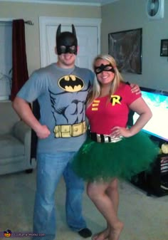 a man and woman dressed up as batman and robin