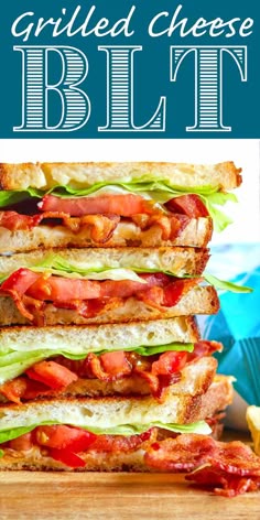 the grilled cheese blth sandwich is stacked on top of each other with lettuce and tomato slices