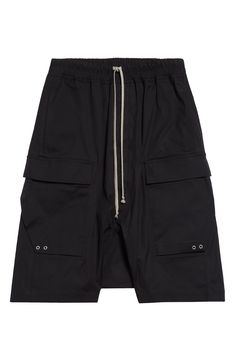 Angluar cargo pockets bring signature Rick Owens edge to these stretchy cotton cargo shorts. 36" inseam; 32" leg opening; 13 1/2" front rise; 17 1/2" back rise (size 50EU) Elastic/drawstring waist Cargo bellows pockets 97% cotton, 3% elastane Hand wash, line dry Made in Italy Designer Clothing Baggy Utility Shorts With Side Pockets, Utility Cargo Knee-length Shorts, Utility Cargo Shorts With Multiple Pockets, Utility Cargo Style Knee-length Shorts, Utility Knee-length Cargo Shorts, Streetwear Cargo Shorts With Patch Pockets, Short Cargo Pants With Patch Pockets For Streetwear, Black Cargo Shorts With Side Pockets, Black Cargo Skirt With Pockets