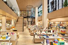 the inside of a store filled with lots of shelves full of books and other items