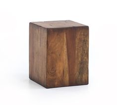 a wooden block sitting on top of a white surface