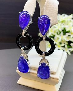 ONE OF A KIND HANDCRAFTED EARRINGS. IN STOCK! READY FOR SHIPPING! GIFT WRAP AVAILABLE! FREE UPS EXPRESS! MAJESTIC! Enormous Tanzanites in pairs! Extremely rare! Wear these earrings to a party and everyone will not be able to take their eyes off! So huge and so vivid blue. STUNNING 59.34TCW, Certified TANZANITE and diamond chandelier earrings. UNIQUE DESIGN! ONE OF A KIND! TRANSPARENT, LARGE, SPARKLING GEMSTONES IN PAIRS! Extremely rare! Surrounded by TOP GRADE, F/VS DIAMONDS! Set in 18K solid wh Luxury Tanzanite Drop Earrings, Luxury Tanzanite Earrings, Luxury Tanzanite Gemstone Earrings, Luxury Tanzanite Earrings With Gemstone, Formal Drop Cabochon Earrings, Luxury Tanzanite Pear-shaped Jewelry, Luxury Sapphire Drop Jewelry, Formal Tanzanite Teardrop Earrings, Luxury Pear-shaped Tanzanite Jewelry