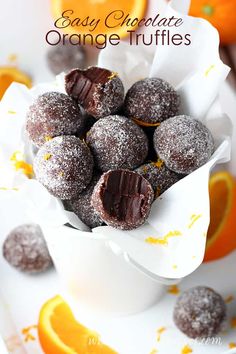 chocolate orange truffles are in a white bowl