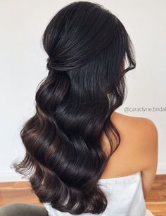 the back of a woman's head with long dark hair